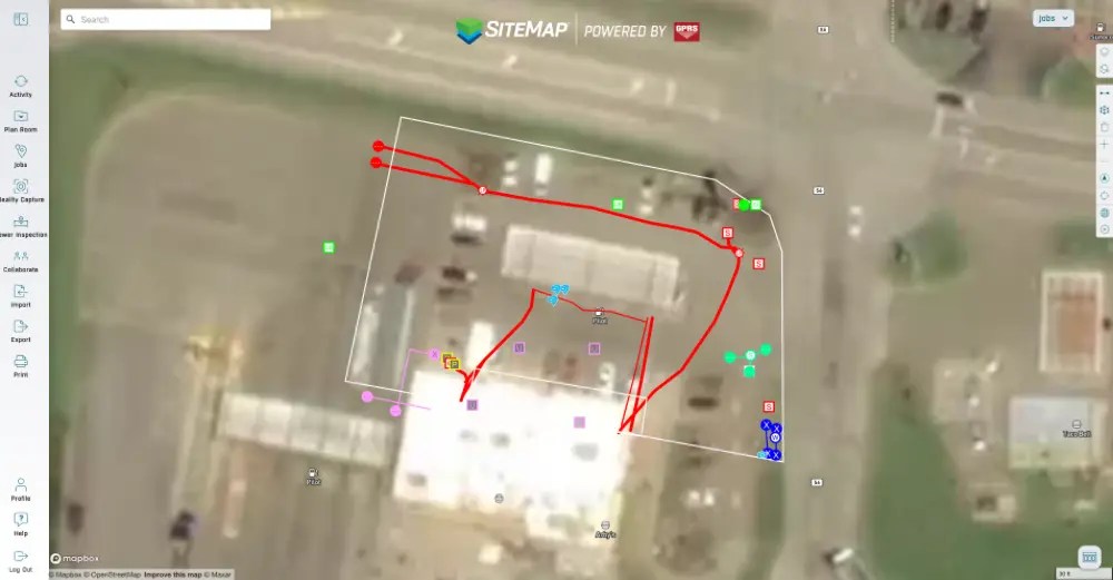 SiteMap® interface showing an aerial view of a building with utility data, colored markers, and mapping tools.