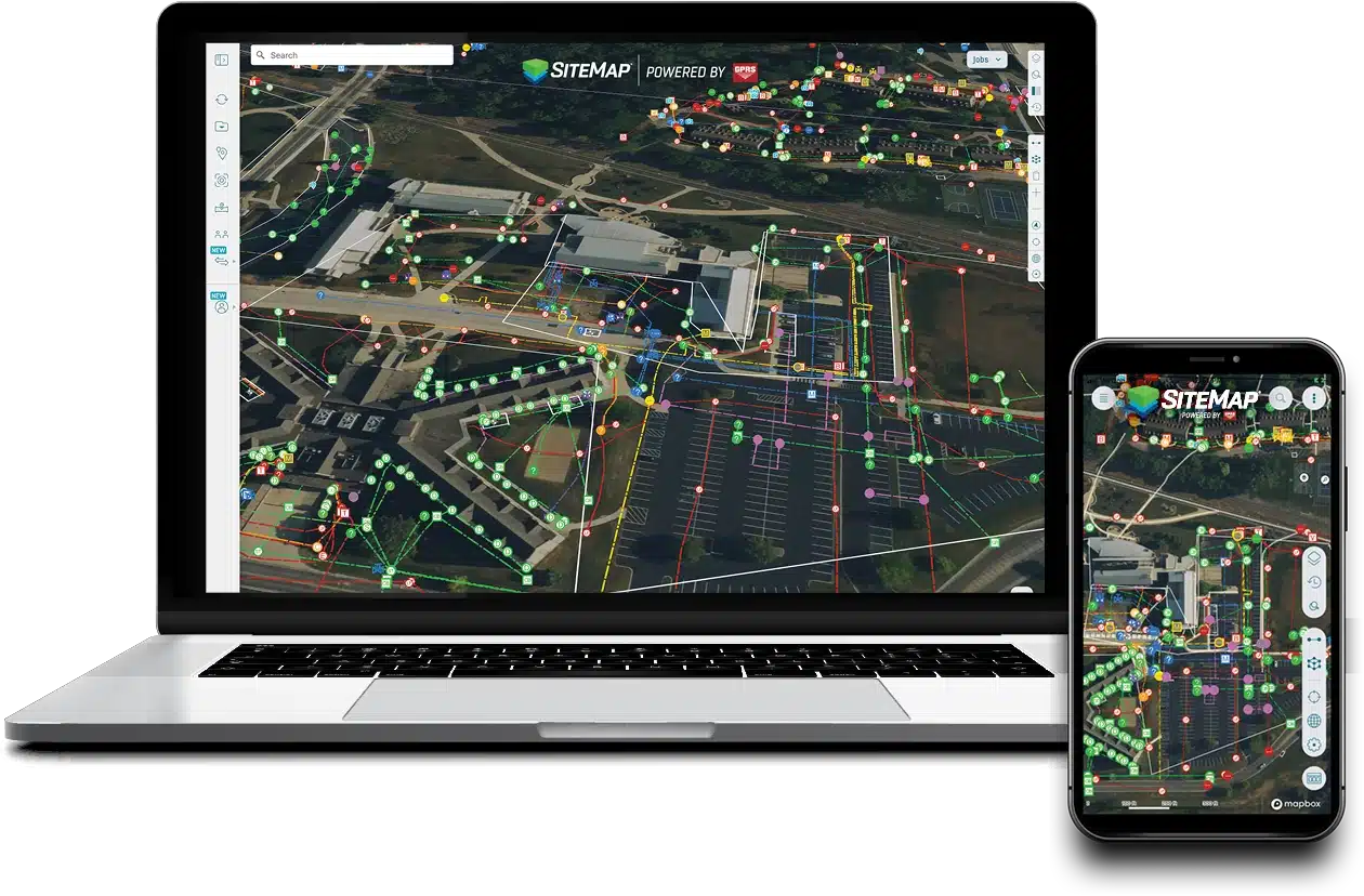 Laptop and smartphone displaying the SiteMap® platform with an aerial site map showing color-coded utility lines and infrastructure data.