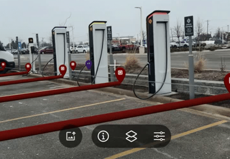 Electric vehicle charging stations in a parking lot, digitally mapped in SiteMap® to show charger locations, layout, and connections for facility management.
