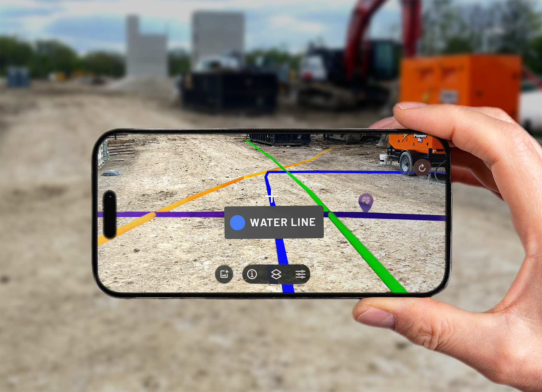 A smartphone displays SiteMap augmented reality utility lines over a construction site, highlighting a labeled water line and other underground utility paths.